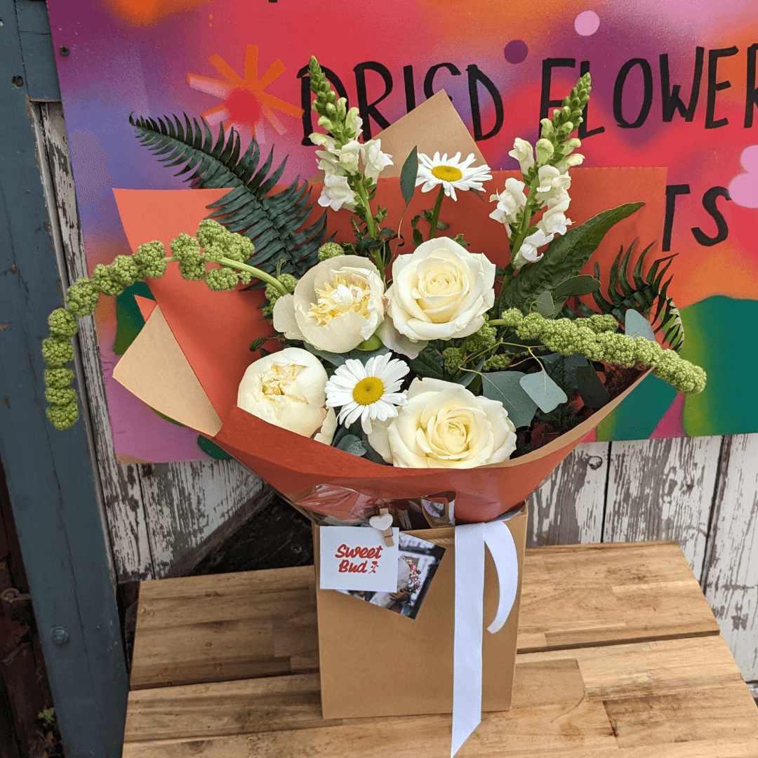 modern, unusual flower bouquet in creams, greens and whites